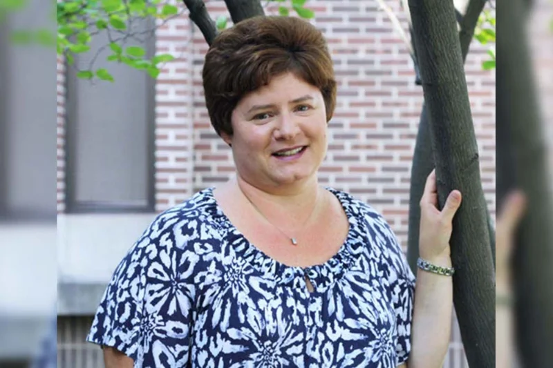 headshot of a woman wearing a necklace and a blue and white shrit Andrea Novak Receives National NSSLHA Advisor Honors Award